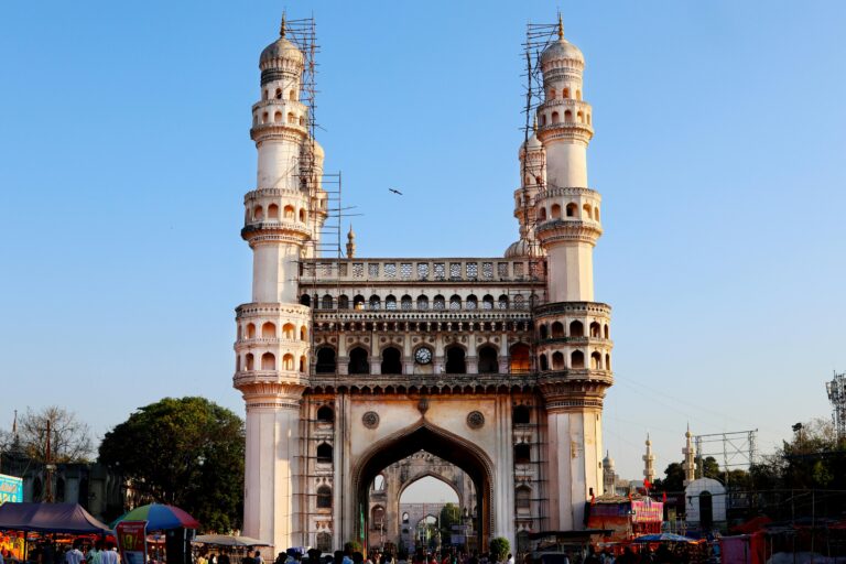 Beautiful view of Charminar in Hyderabad, India, with clear blue skies. A historic monument and major tourist attraction.